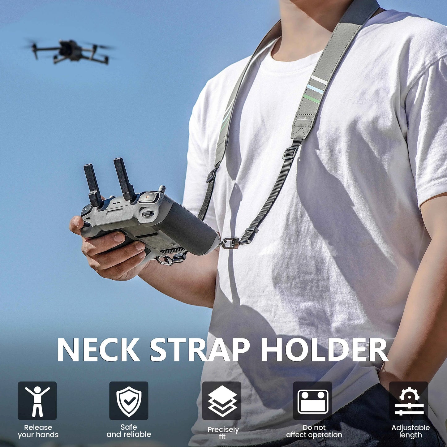 A person wearing a white t-shirt and holding a drone controller, with a gray neck strap holder sling around the neck. A drone is flying in the blue sky background.